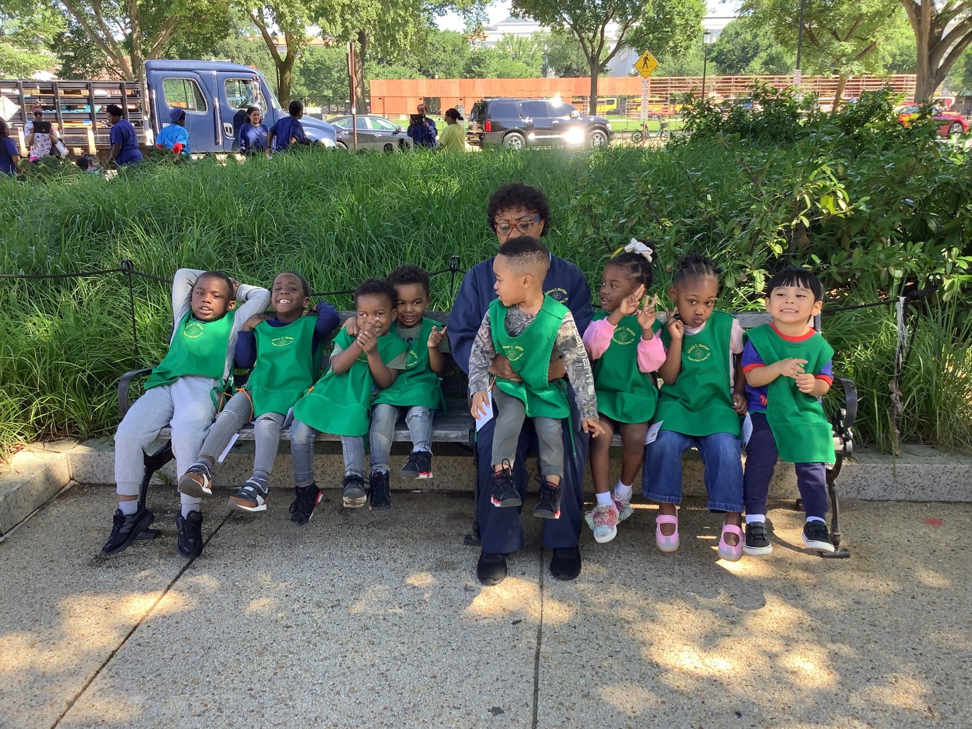 Children & Teacher Resting Outside